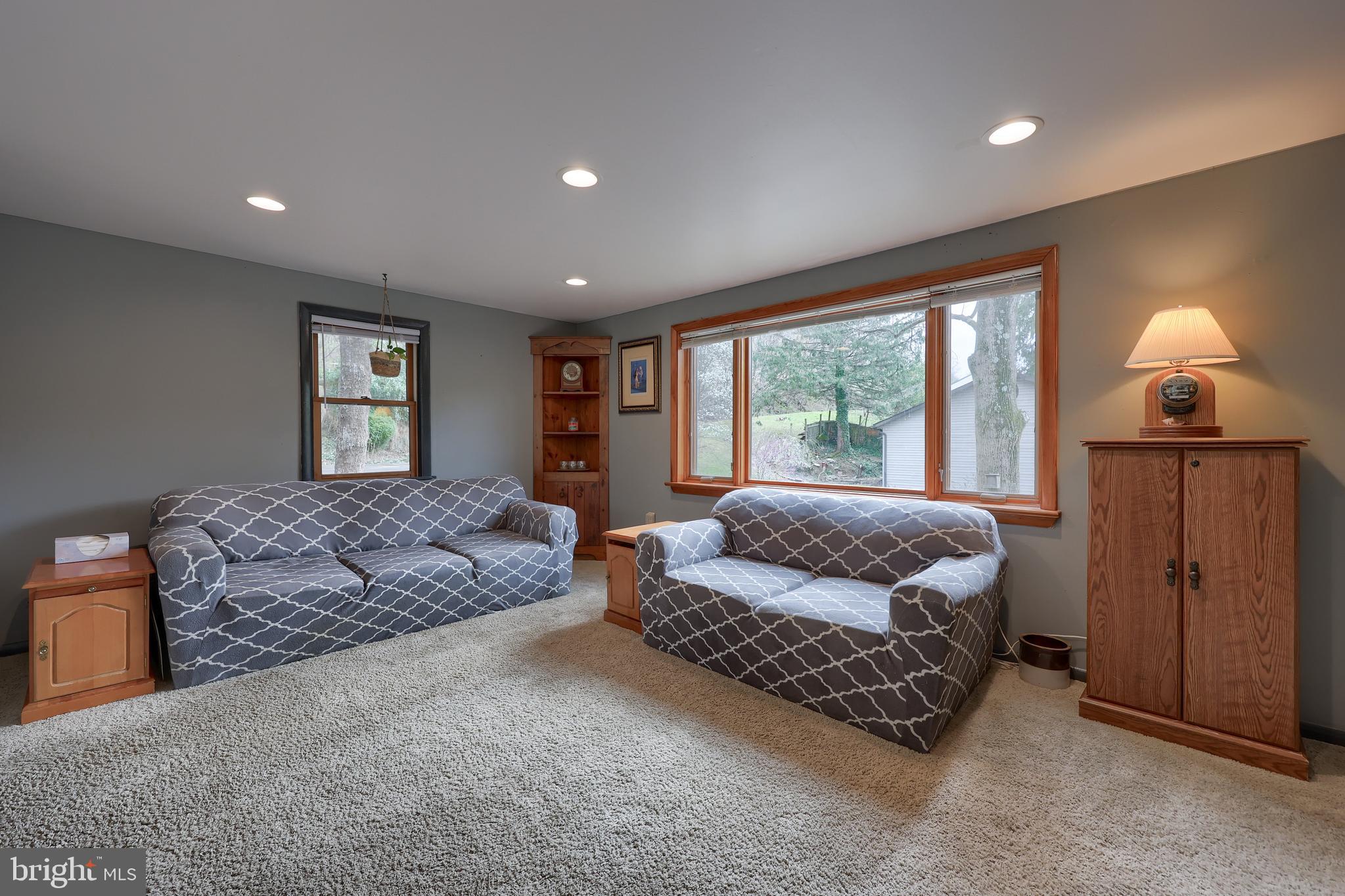 378 Bridge Valley Road Pequea, PA 17565 - Photo 5 of 42 a bedroom with a bed and window with couch