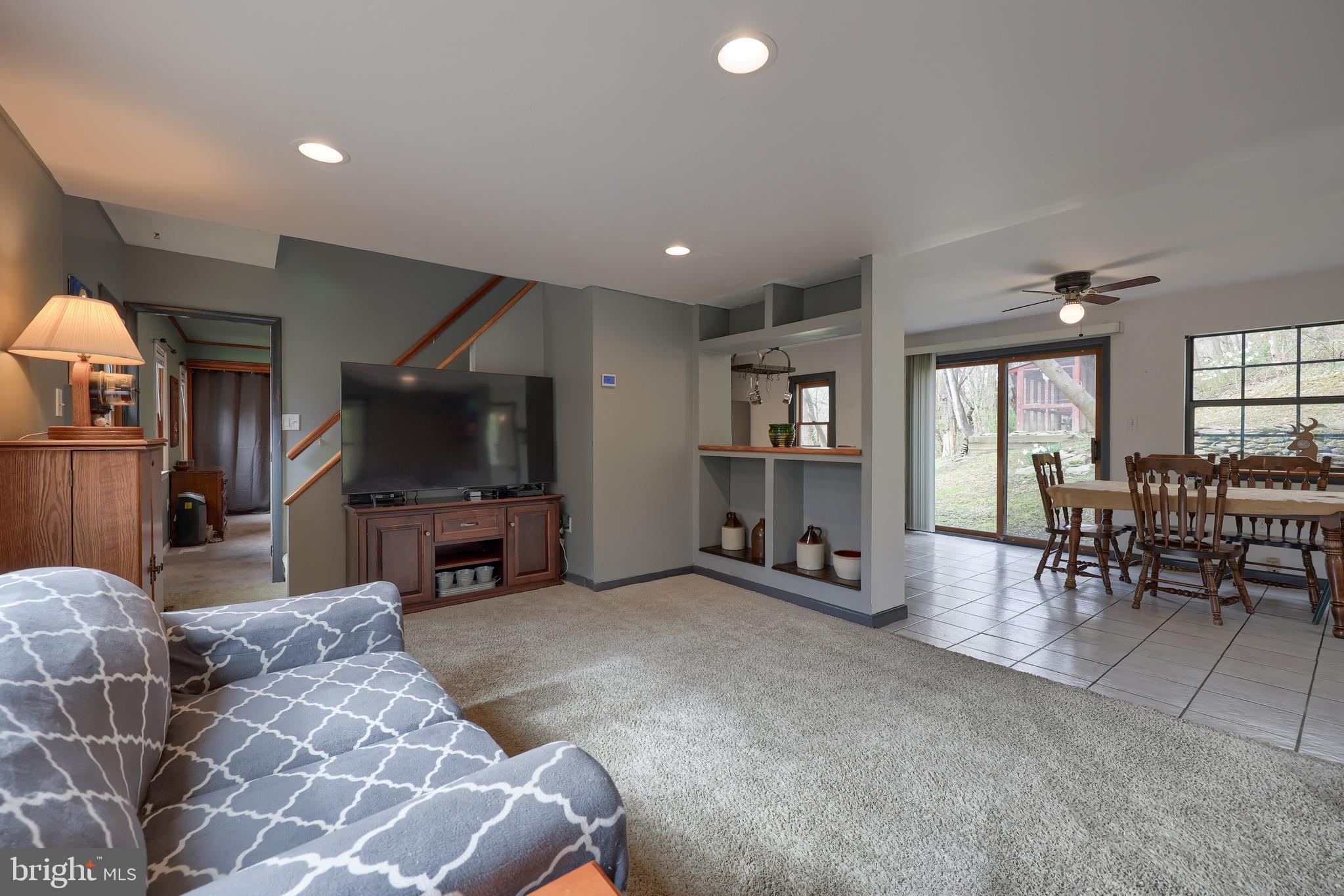378 Bridge Valley Road Pequea, PA 17565 - Photo 7 of 42 a living room with furniture and a flat screen tv