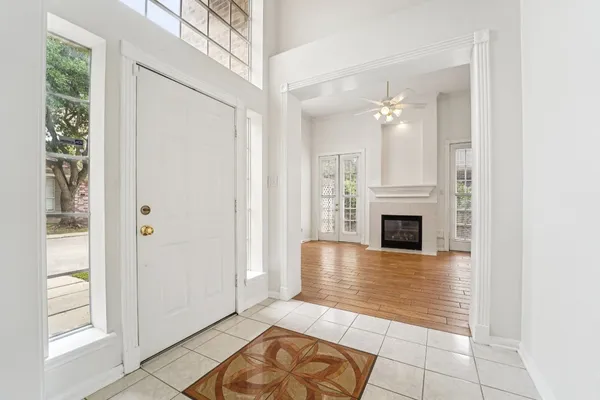 a view of a livingroom with an empty space and a fireplace