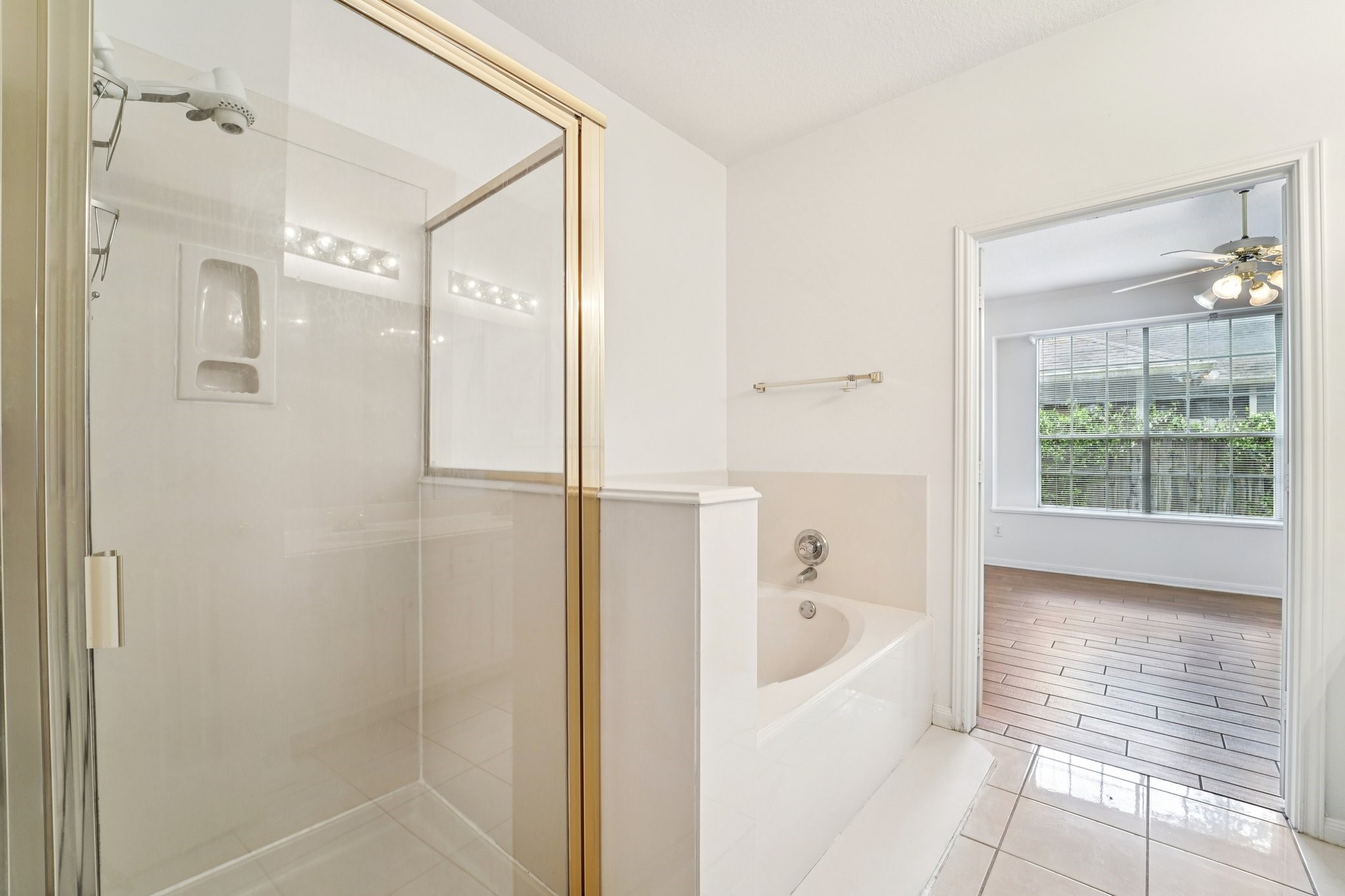 14420 Walters Road, Unit 55 Houston, TX 77014 - Photo 25 of 35 a bathroom with a bathtub and a shower