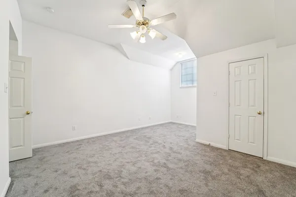 a view of a backyard with a large tree