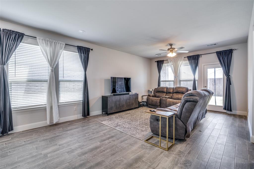 1069 Norias Drive Forney, TX 75126 - Photo 14 of 36 a living room with furniture and a large window