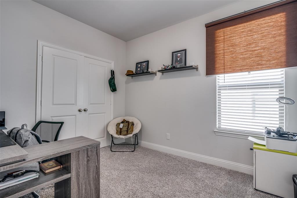 1069 Norias Drive Forney, TX 75126 - Photo 21 of 36 a view of a workspace with furniture and a window