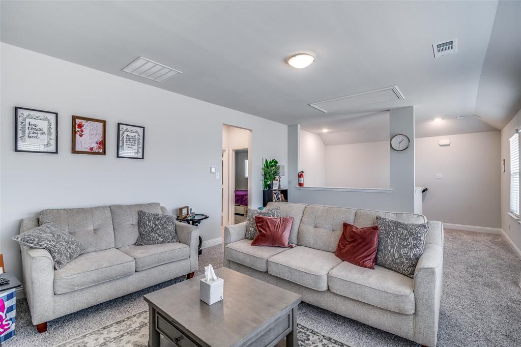 1069 Norias Drive Forney, TX 75126 - Photo 25 of 36 a living room with furniture and a couch