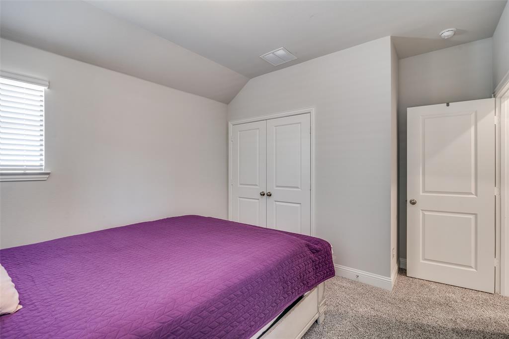 1069 Norias Drive Forney, TX 75126 - Photo 28 of 36 a bedroom with a bed and a closet