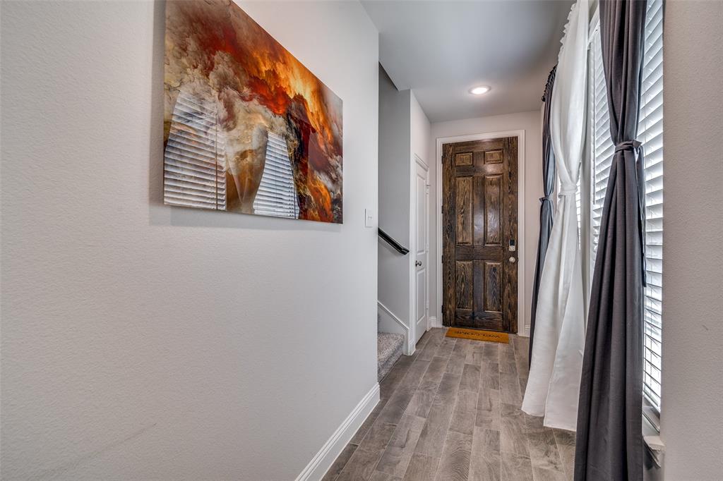 1069 Norias Drive Forney, TX 75126 - Photo 5 of 36 a view of hallway with wooden floor and a window