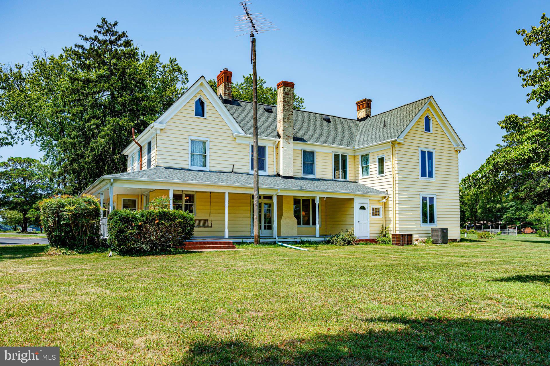 2208 Horns Point Road Cambridge, MD 21613 - Photo 11 of 39 a front view of a house with a garden