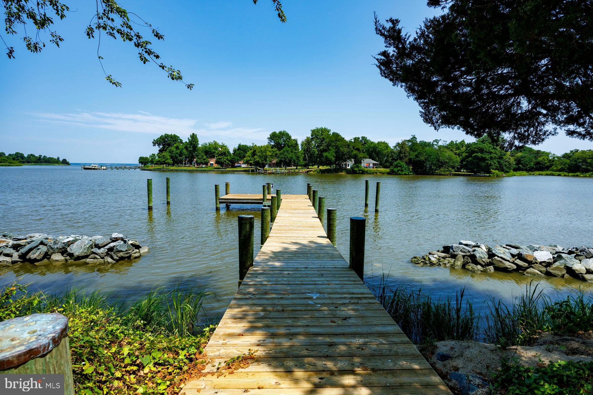 2208 Horns Point Road Cambridge, MD 21613 - Photo 16 of 39 a lake view with sitting space and trees in the background