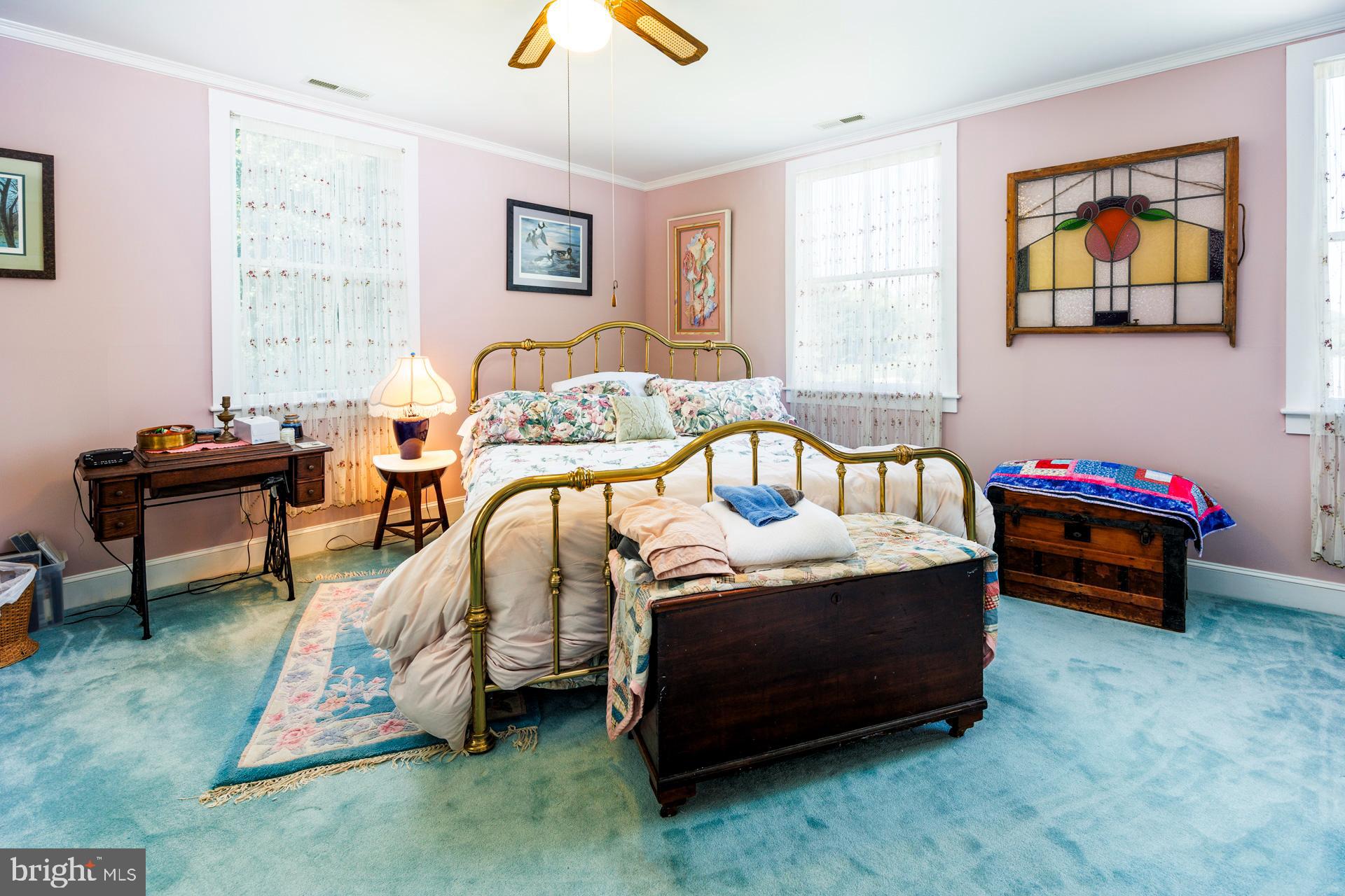 2208 Horns Point Road Cambridge, MD 21613 - Photo 28 of 39 a bedroom with furniture and a bed