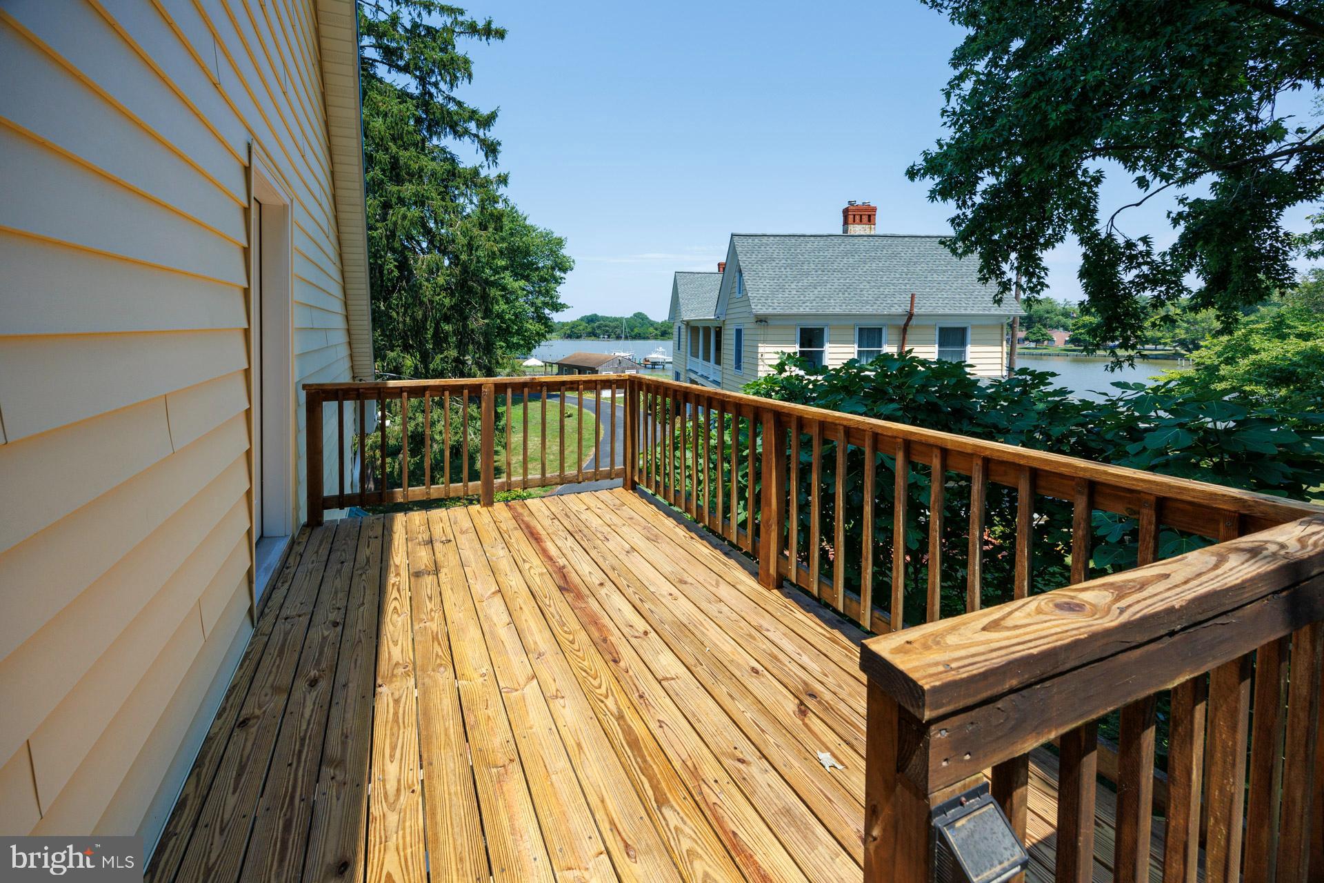 2208 Horns Point Road Cambridge, MD 21613 - Photo 30 of 39 a view of balcony with wooden floor and fence and a potted plant