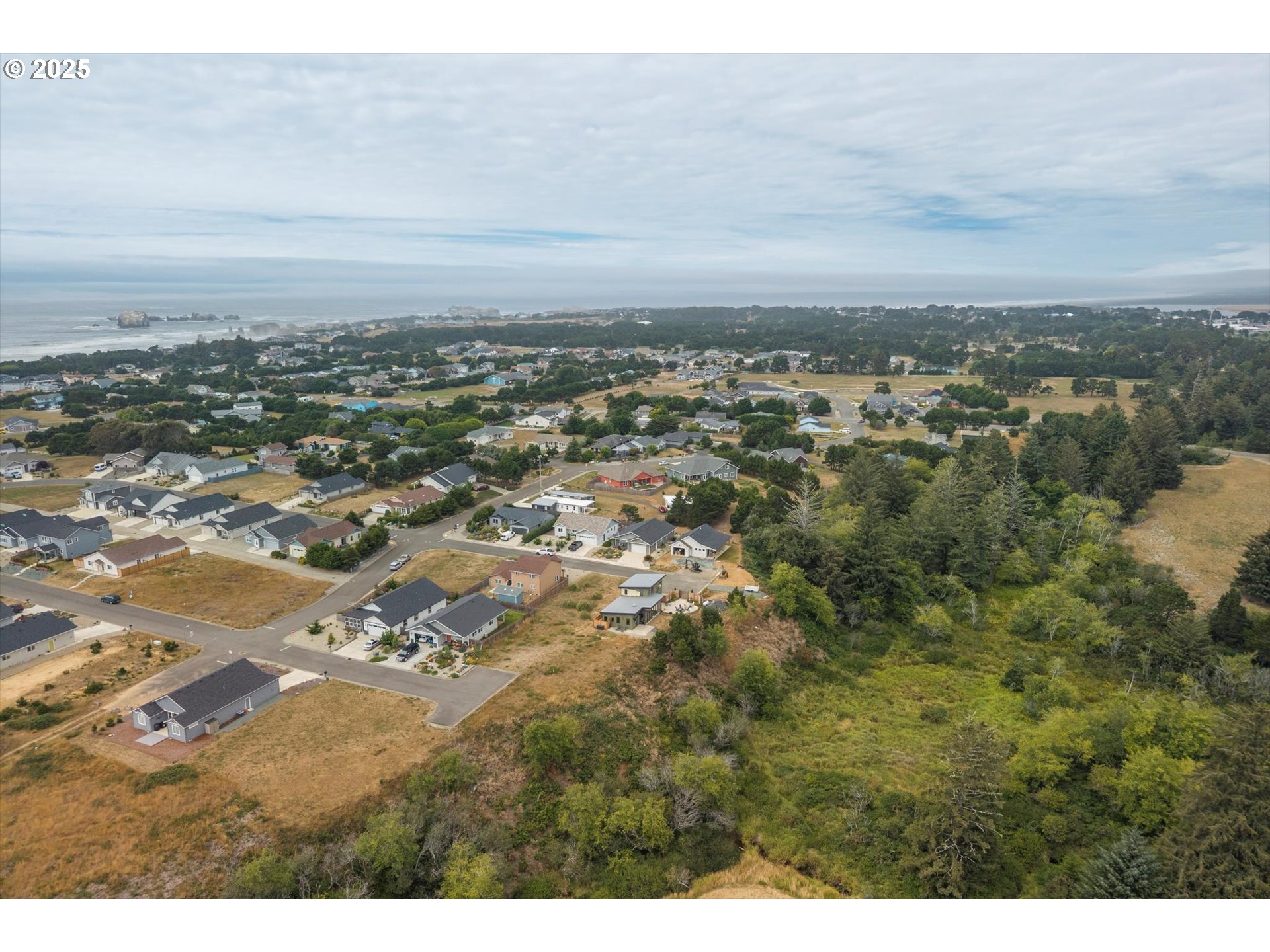 636 Seacrest Drive Bandon, OR 97411 - Photo 17 of 17 an aerial view of residential building and trees