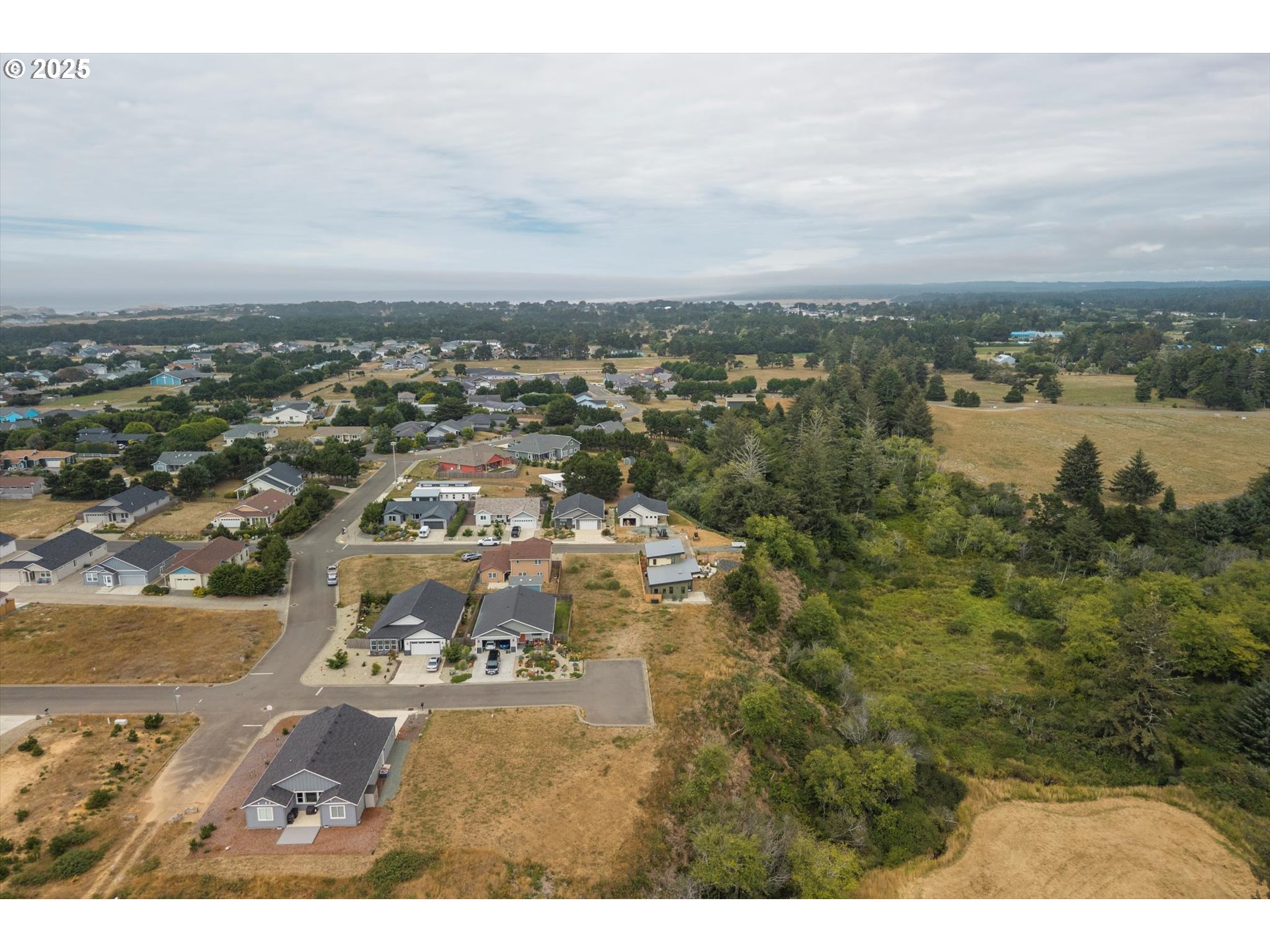 636 Seacrest Drive Bandon, OR 97411 - Photo 10 of 17 an aerial view of residential building and lake view