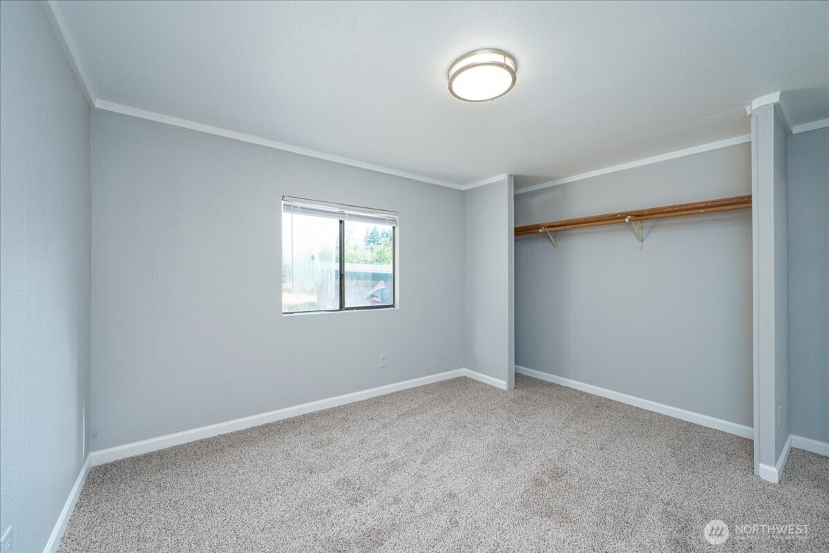 331 Frontier Road Grapeview, WA 98546 - Photo 19 of 39 an empty room with a window