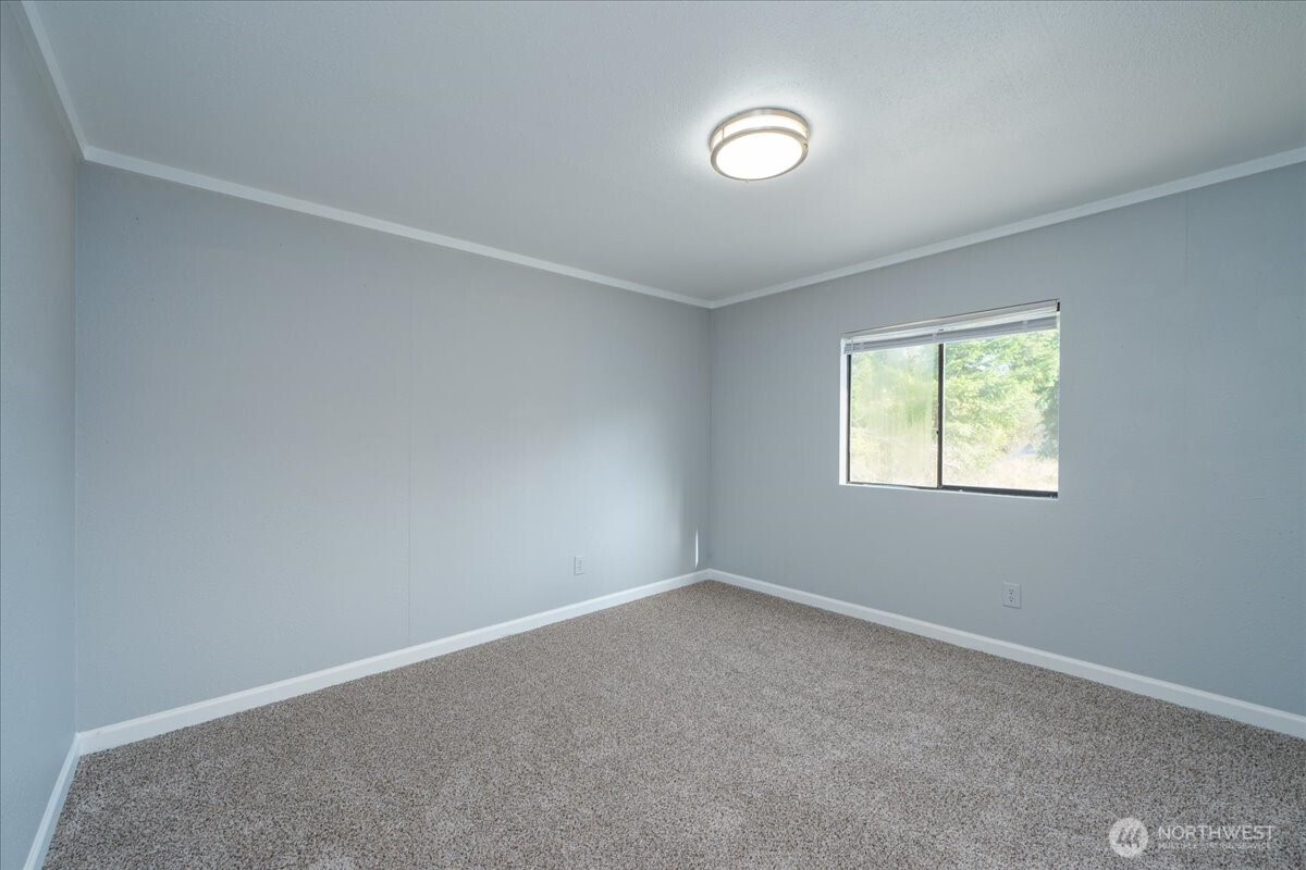 331 Frontier Road Grapeview, WA 98546 - Photo 20 of 39 an empty room with a window