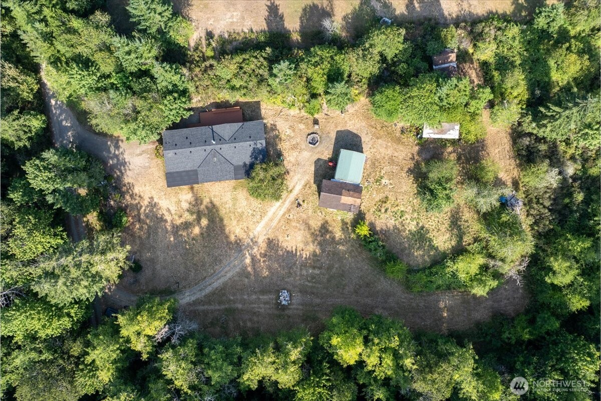 331 Frontier Road Grapeview, WA 98546 - Photo 2 of 39 an aerial view of a house with a yard