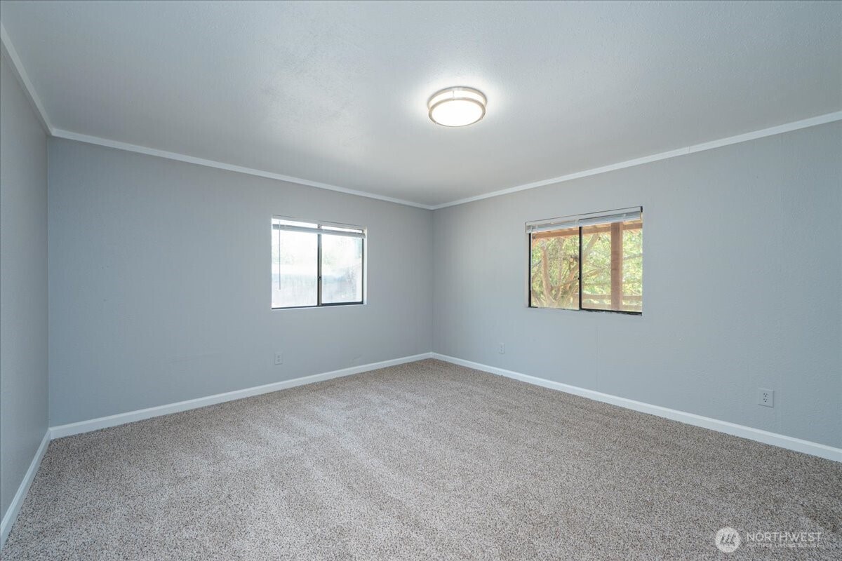 331 Frontier Road Grapeview, WA 98546 - Photo 21 of 39 an empty room with windows