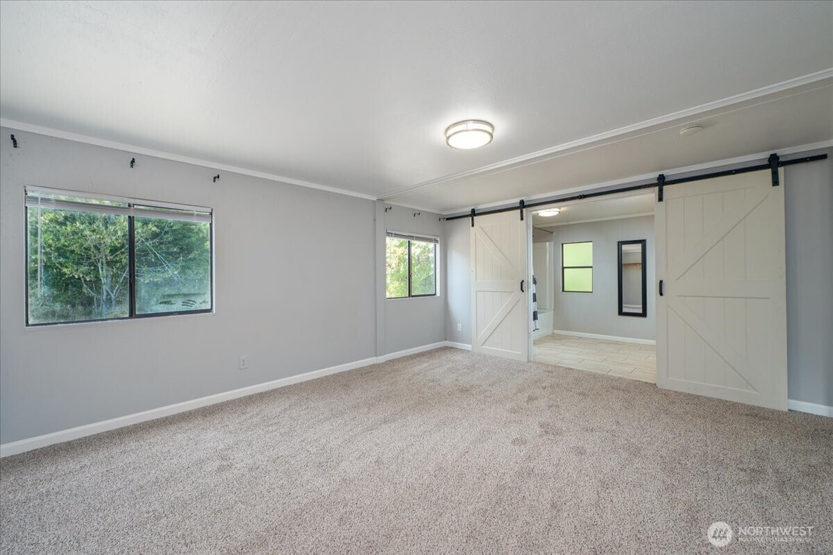 331 Frontier Road Grapeview, WA 98546 - Photo 24 of 39 an empty room with windows