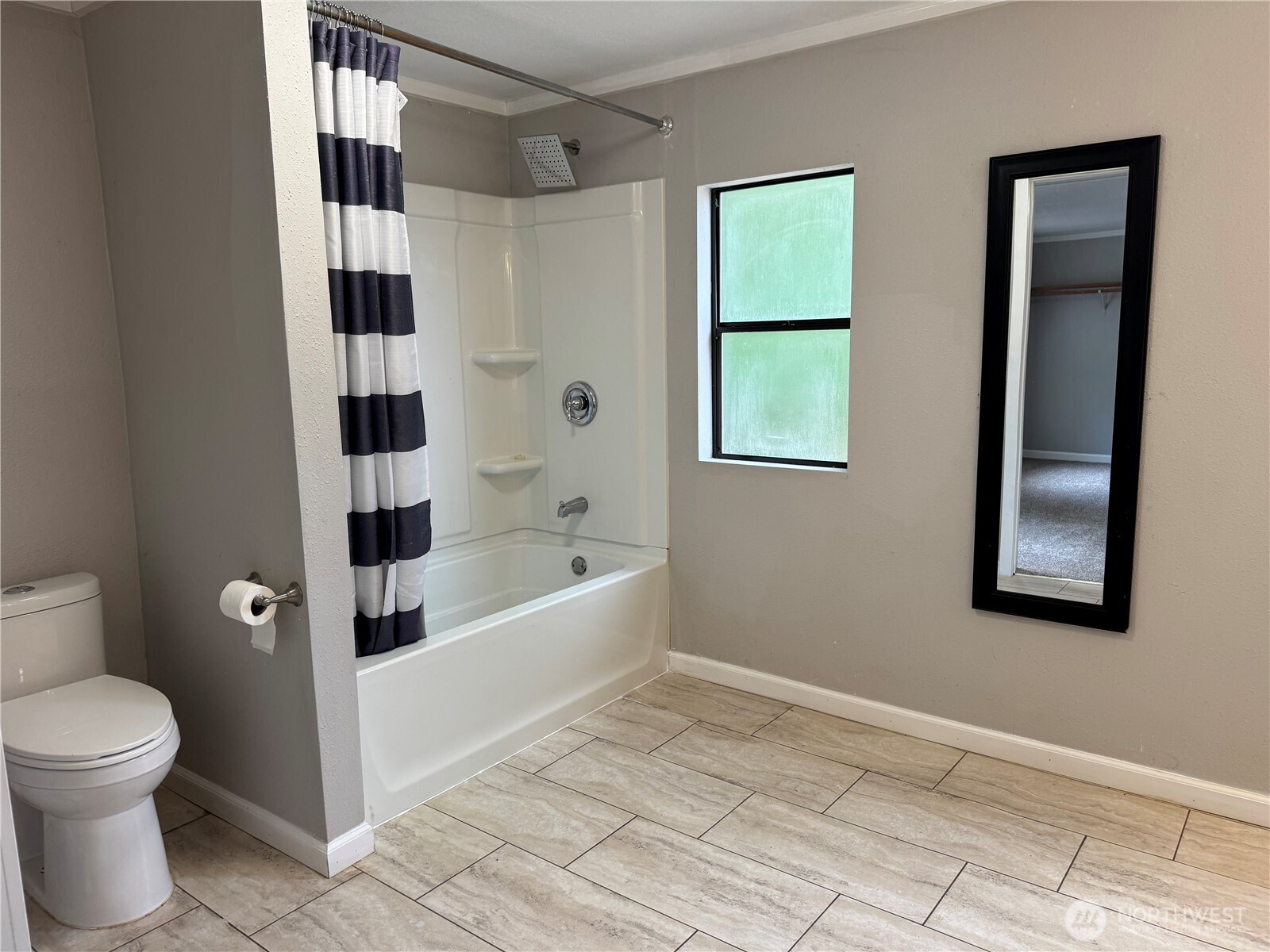 331 Frontier Road Grapeview, WA 98546 - Photo 26 of 39 a bathroom with a toilet and a shower