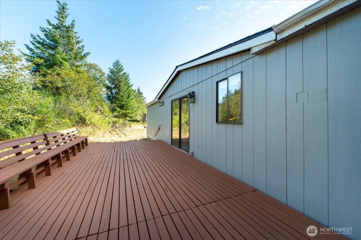 331 Frontier Road Grapeview, WA 98546 - Photo 27 of 39 a balcony with wooden floor