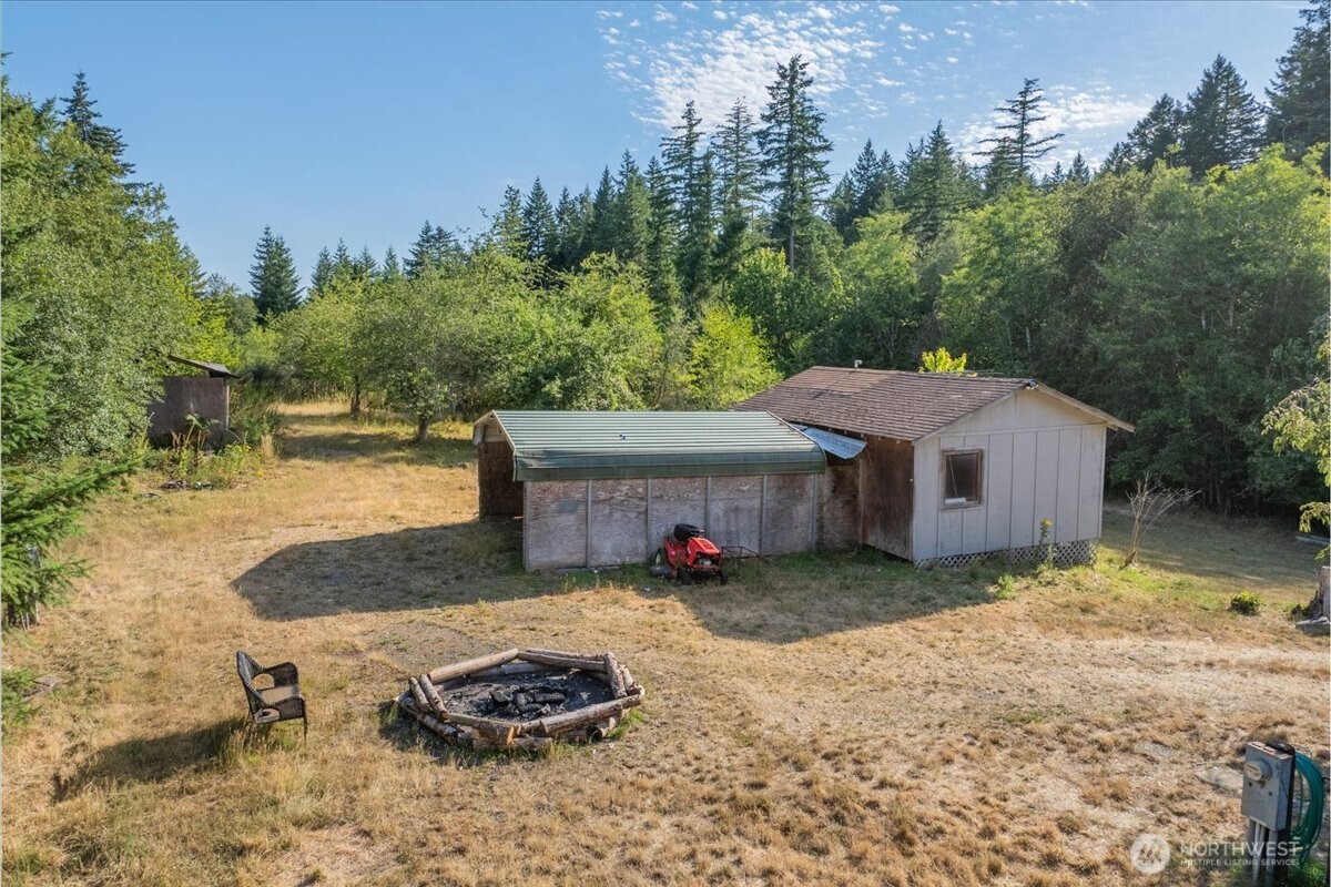 331 Frontier Road Grapeview, WA 98546 - Photo 29 of 39 a view of a house with a yard
