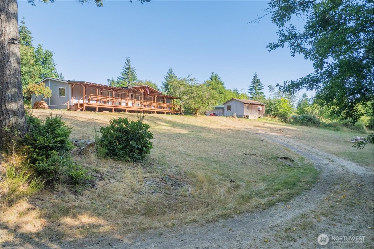 331 Frontier Road Grapeview, WA 98546 - Photo 3 of 39 a view of an outdoor space and a yard