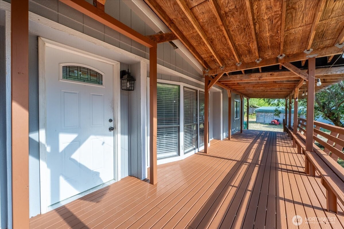 331 Frontier Road Grapeview, WA 98546 - Photo 6 of 39 a view of balcony with wooden floor