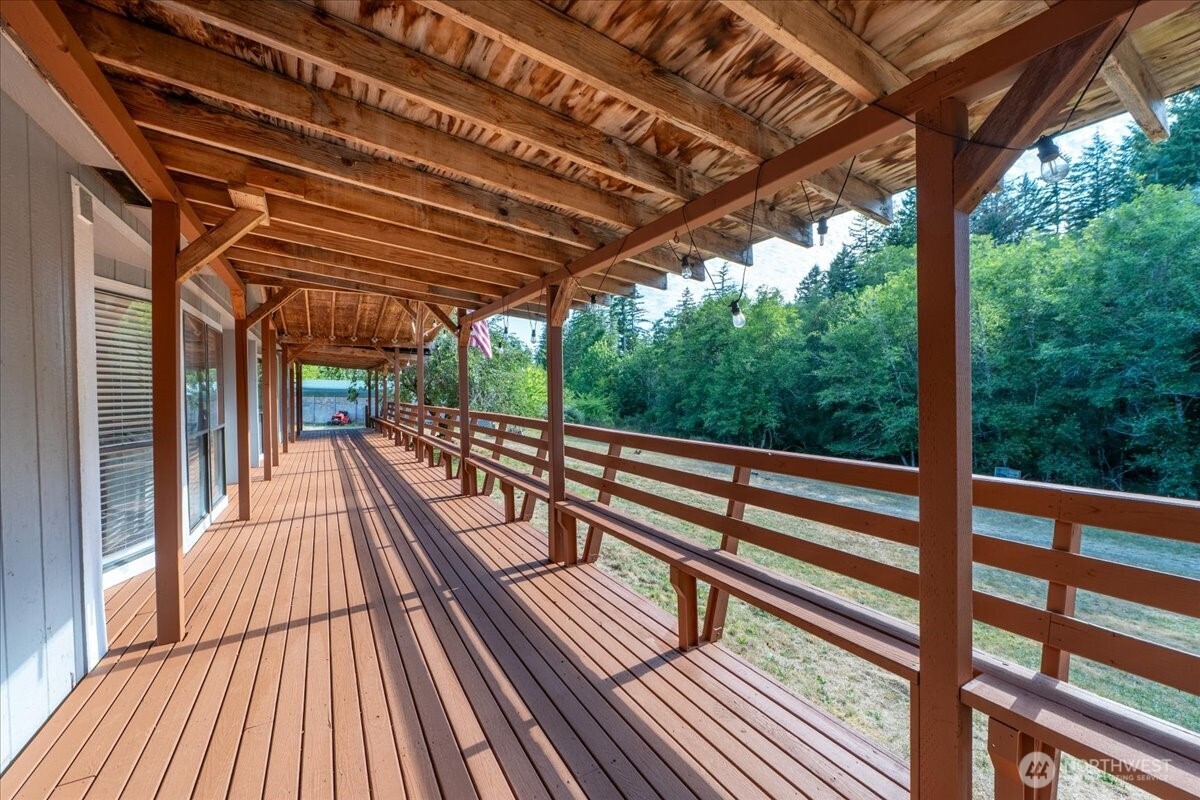 331 Frontier Road Grapeview, WA 98546 - Photo 7 of 39 a view of balcony with wooden floor and wooden fence