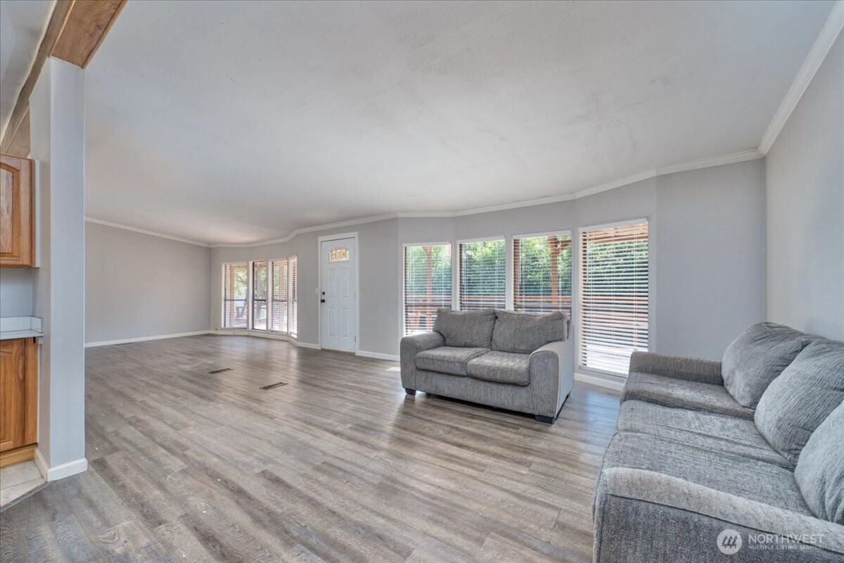 331 Frontier Road Grapeview, WA 98546 - Photo 9 of 39 a living room with furniture and a large window