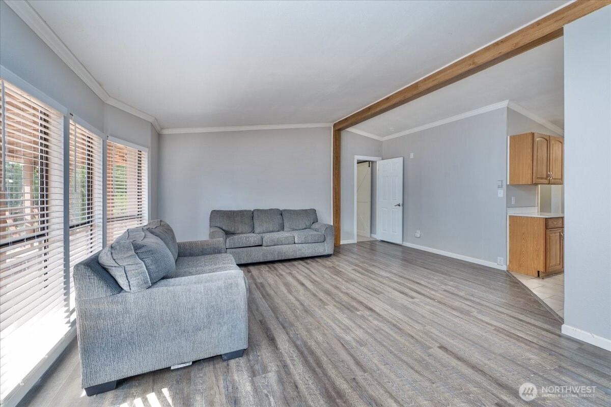 331 Frontier Road Grapeview, WA 98546 - Photo 10 of 39 a living room with furniture and a large window
