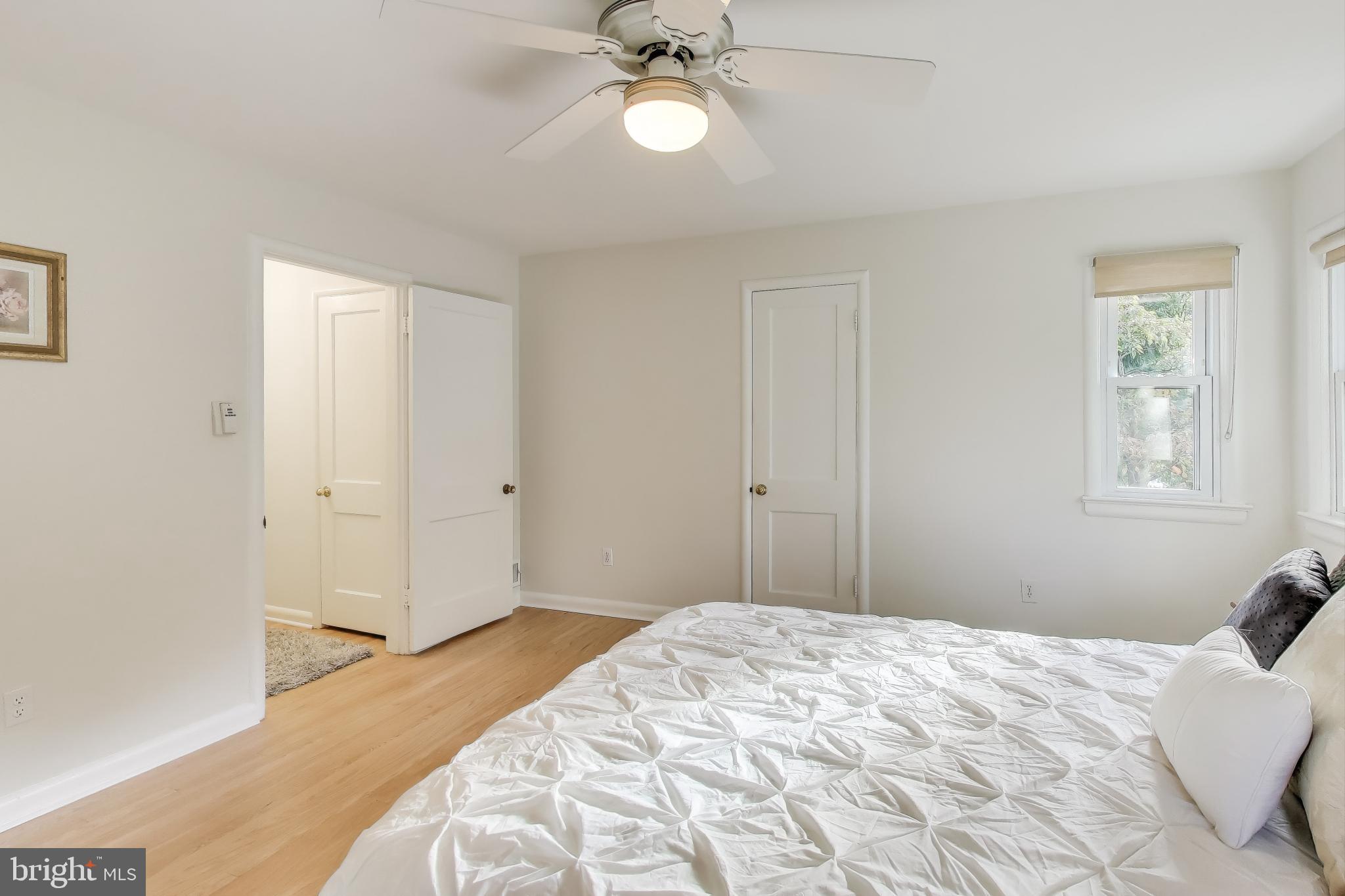 9613 Lorain Avenue Silver Spring, MD 20901 - Photo 18 of 40 a bedroom with a bed and a window