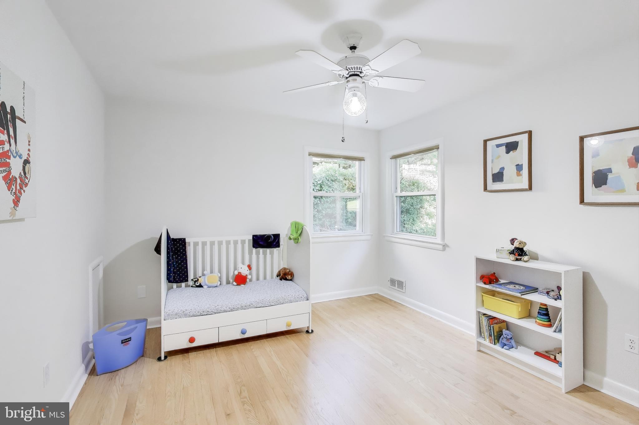 9613 Lorain Avenue Silver Spring, MD 20901 - Photo 21 of 40 a bed room with furniture and a window