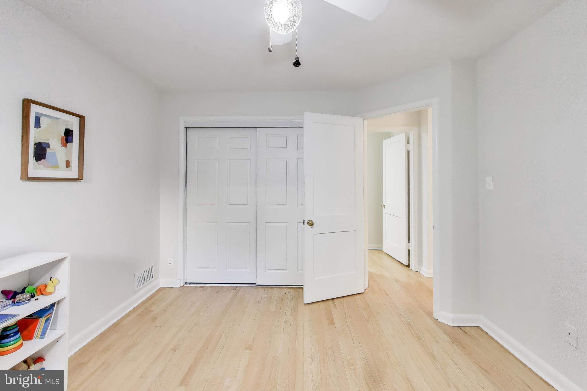 9613 Lorain Avenue Silver Spring, MD 20901 - Photo 22 of 40 a view of empty room with wooden floor