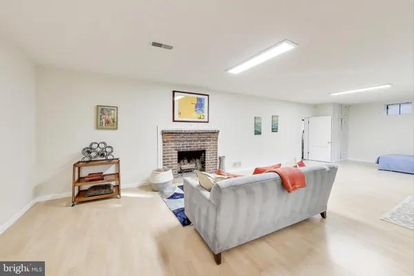 a bedroom with a bed and a fireplace