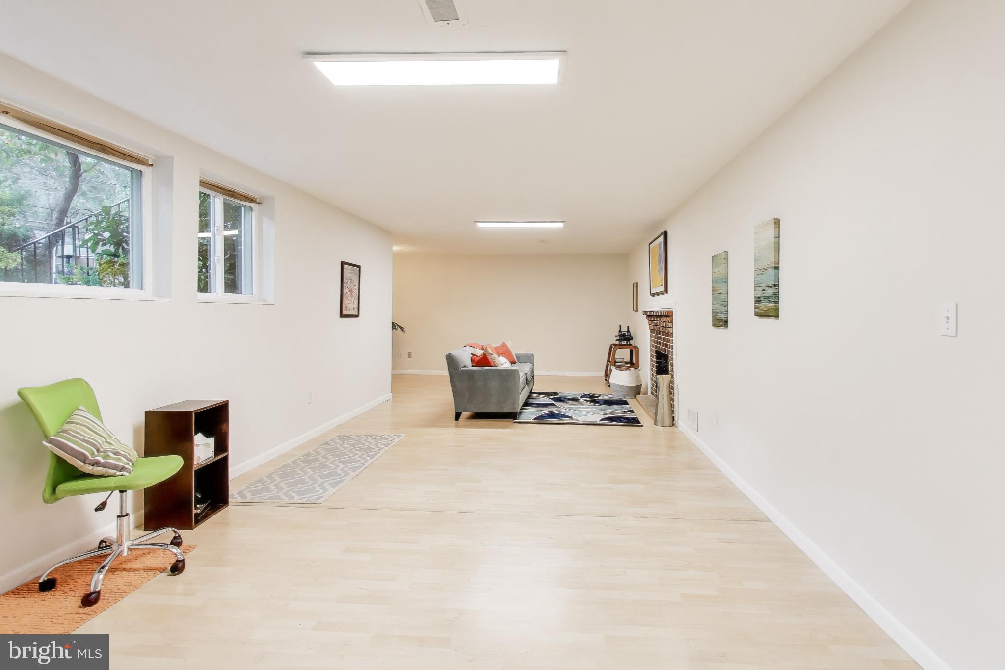 9613 Lorain Avenue Silver Spring, MD 20901 - Photo 28 of 40 a living room with furniture and a table