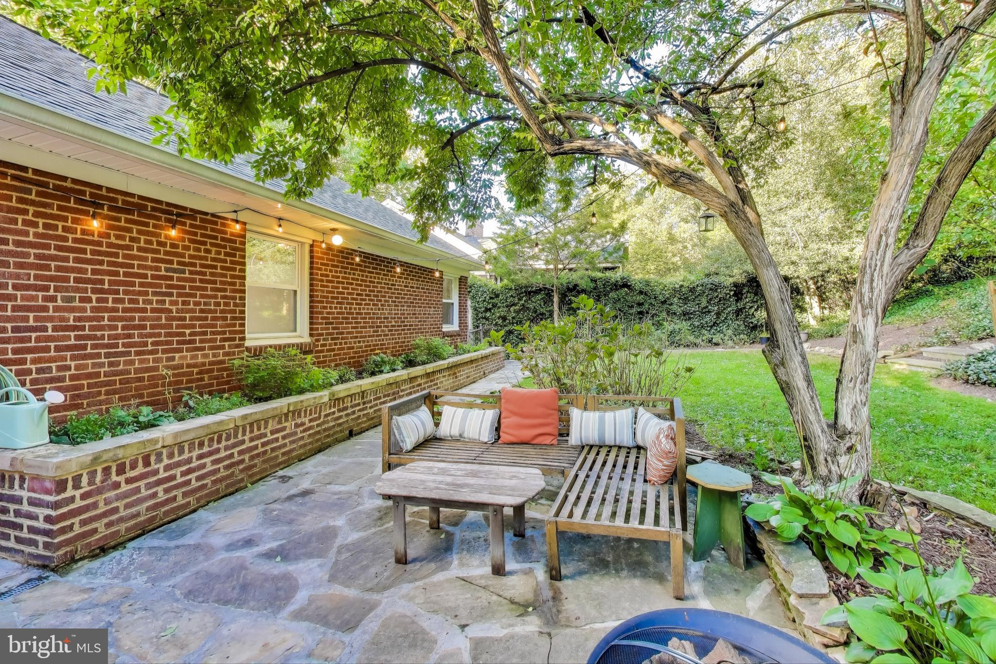 9613 Lorain Avenue Silver Spring, MD 20901 - Photo 36 of 40 a view of a patio with table and chairs and wooden fence