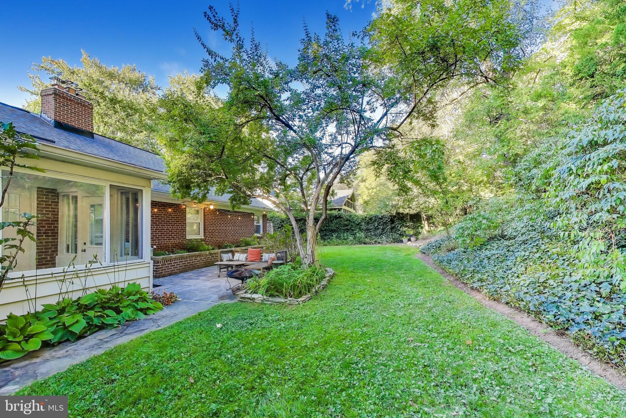 9613 Lorain Avenue Silver Spring, MD 20901 - Photo 40 of 40 a view of a chair and table in backyard of the house