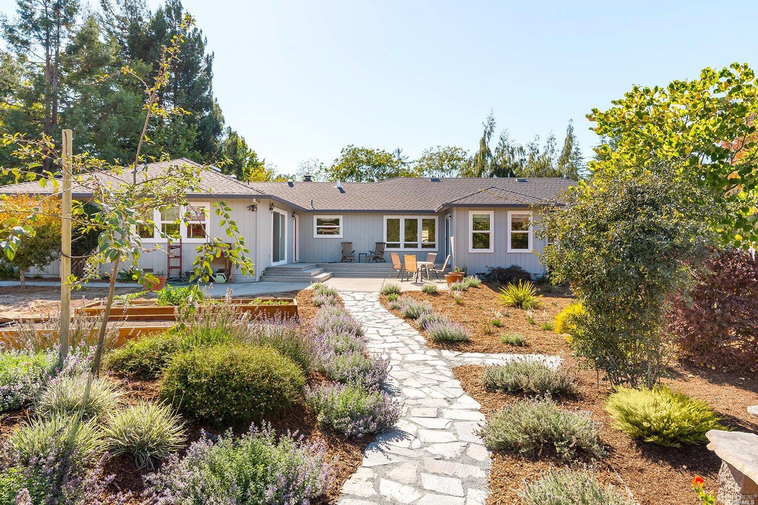 2133 Schaeffer Road Sebastopol, CA 95472 - Photo 1 of 1 a front view of a house with a yard and outdoor seating