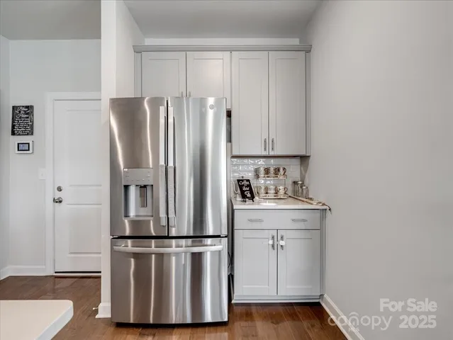 a kitchen with cabinets and stainless steel appliances