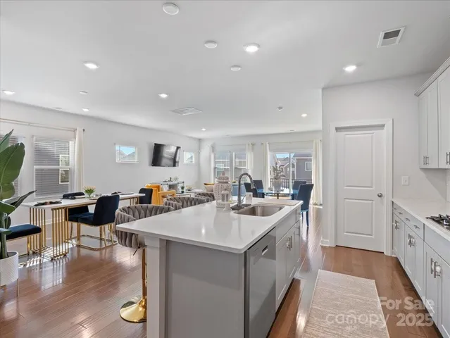 a kitchen with counter and chairs