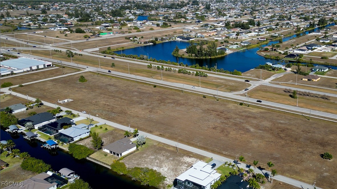 528-600 Burnt Store Road North Cape Coral, FL 33993 - Photo 15 of 16 an aerial view of a residential houses with yard