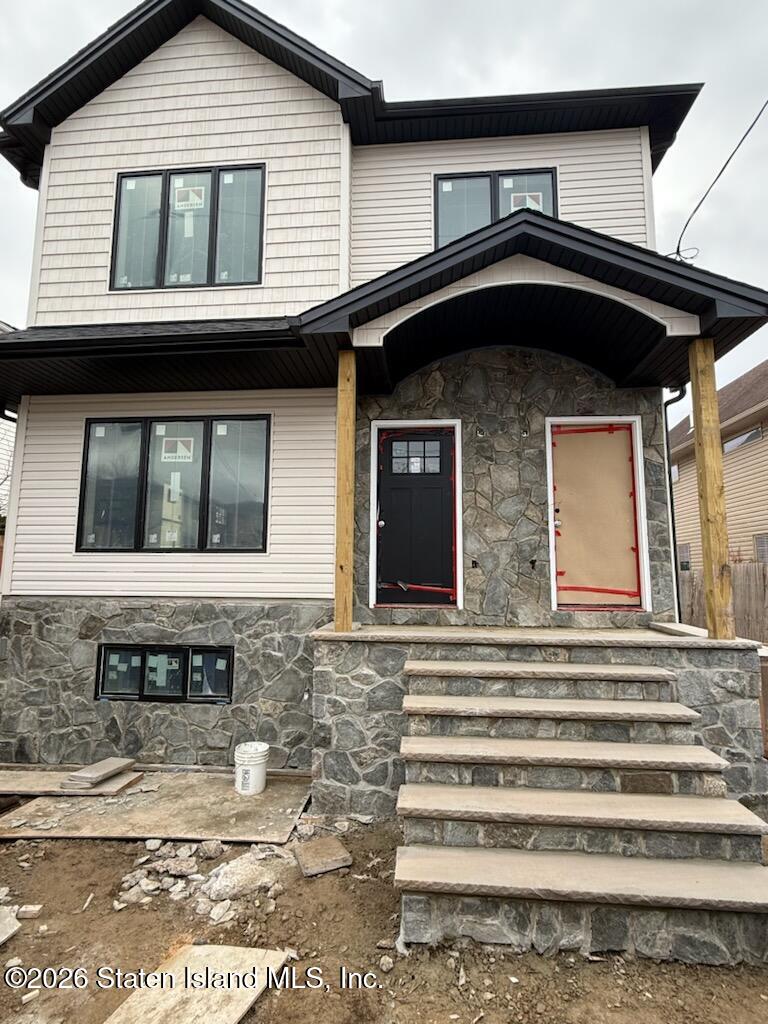228 Sinclair Avenue Staten Island, NY 10312 - Photo 1 of 5 a front view of a house with a balcony