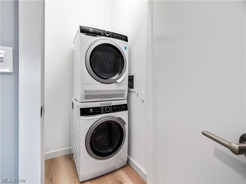 2401 Scranton Road, Unit A Cleveland, OH 44113 - Photo 10 of 17 Dedicated laundry area featuring a stacked washer and dryer unit