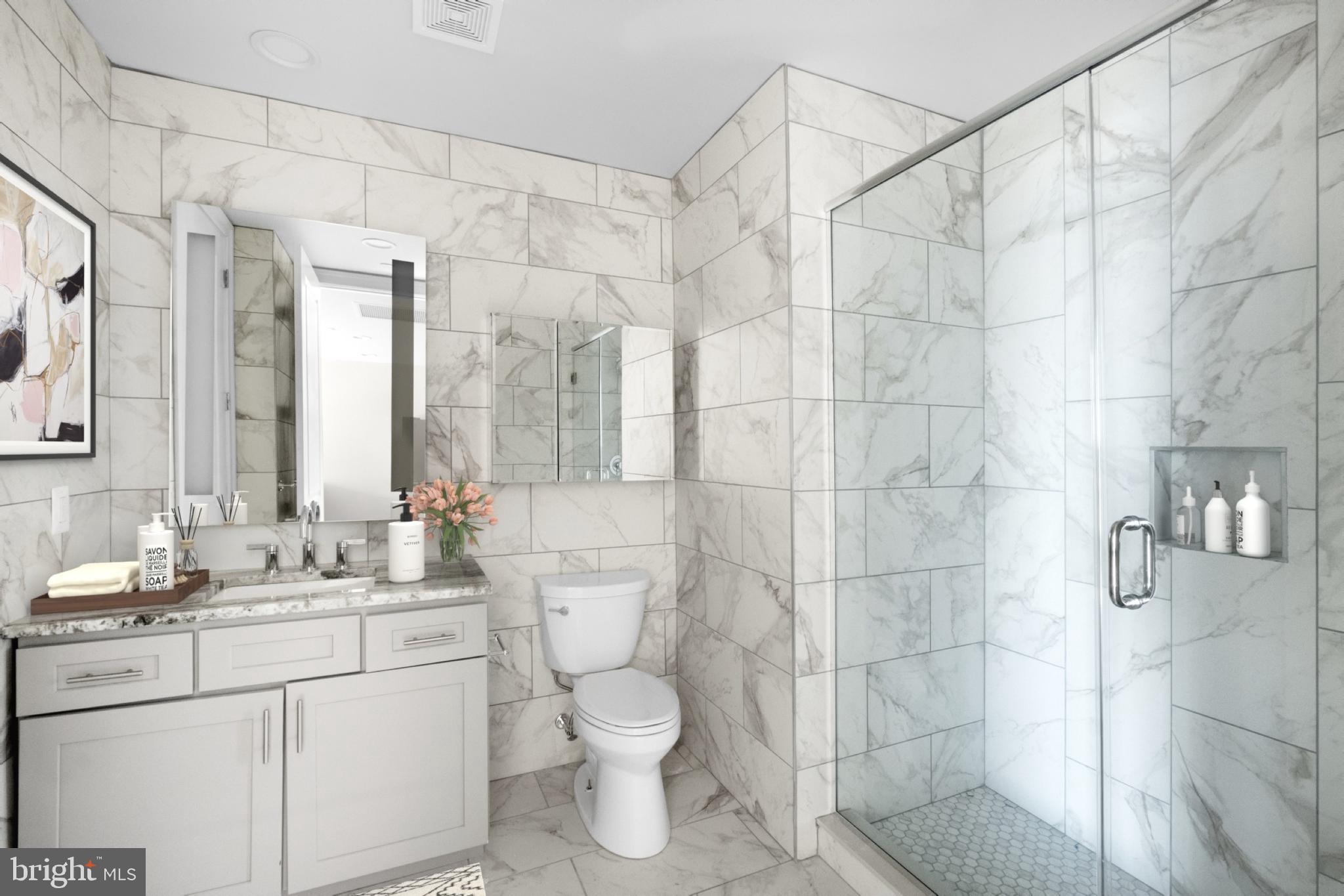 2301-61 John F Kennedy Boulevard, Unit 613 Philadelphia, PA 19103 - Photo 13 of 42 a bathroom with a sink toilet and shower