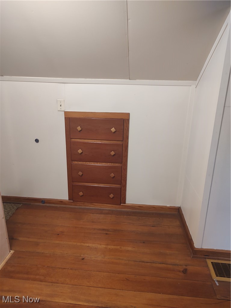 5434 East State Road Newcomerstown, OH 43832 - Photo 22 of 34 Built ins and hardwood flooring upstairs.