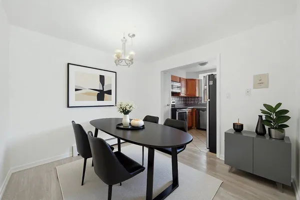 a view of a dining room with furniture and wooden floor