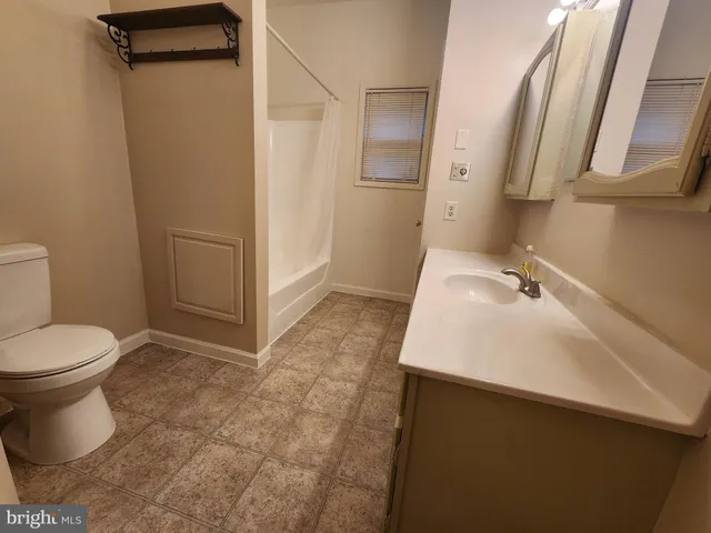 a view of a bathroom from a hallway