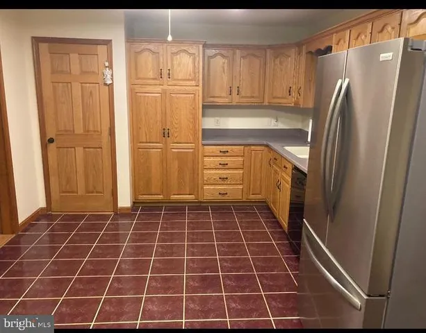 a bathroom with a glass door shower and a sink
