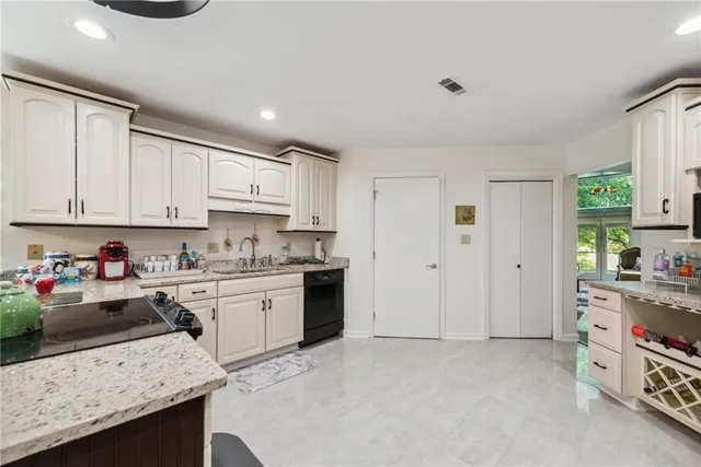 a large kitchen with cabinets