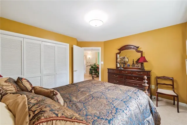 a spacious bathroom with a tub sink and mirror