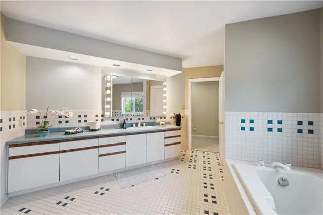 a bed room with a bed and a chandelier